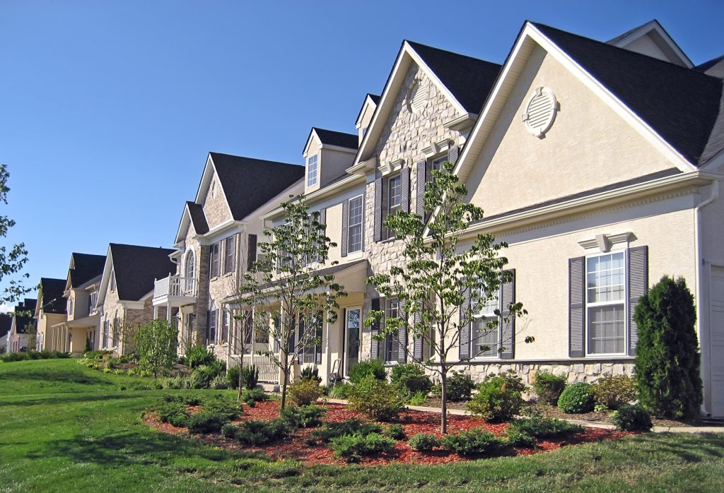 A row of upscale new houses in the suburbs.